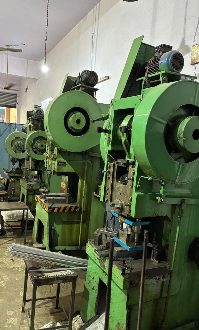 Row of power presses on the G.G Metal Works shop floor